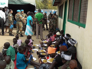 Civilians receiving food aid at the United Nations Mission in South Sudan camp run by an Indian Battalion in Pibor, Jonglei state, December 2012 (ST)