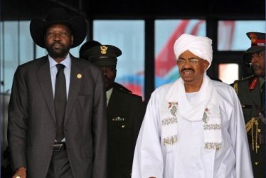 President Omer Al-Bashir receives his South Sudanese counterpart Salva Kiir after his arrival in Khartoum in October 2011 (AFP)