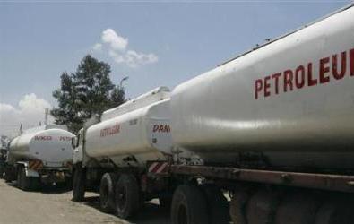 Trucks transporting oil, petrol and gas wait to reload outside a depot in the outskirts of Nairobi September 30, 2008. (Reuters)