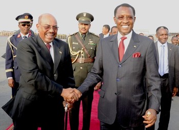 Chadian president Idriss Deby (R) shakes hands with his Sudanese counterpart, Omer Hassan al-Bashir, at a meeting for the Community of Sahel-Saharan States (CEN-SAD) in N'Djamena on 16 February 2013 (Photo: Ibrahim Adji/AFP/Getty Images)