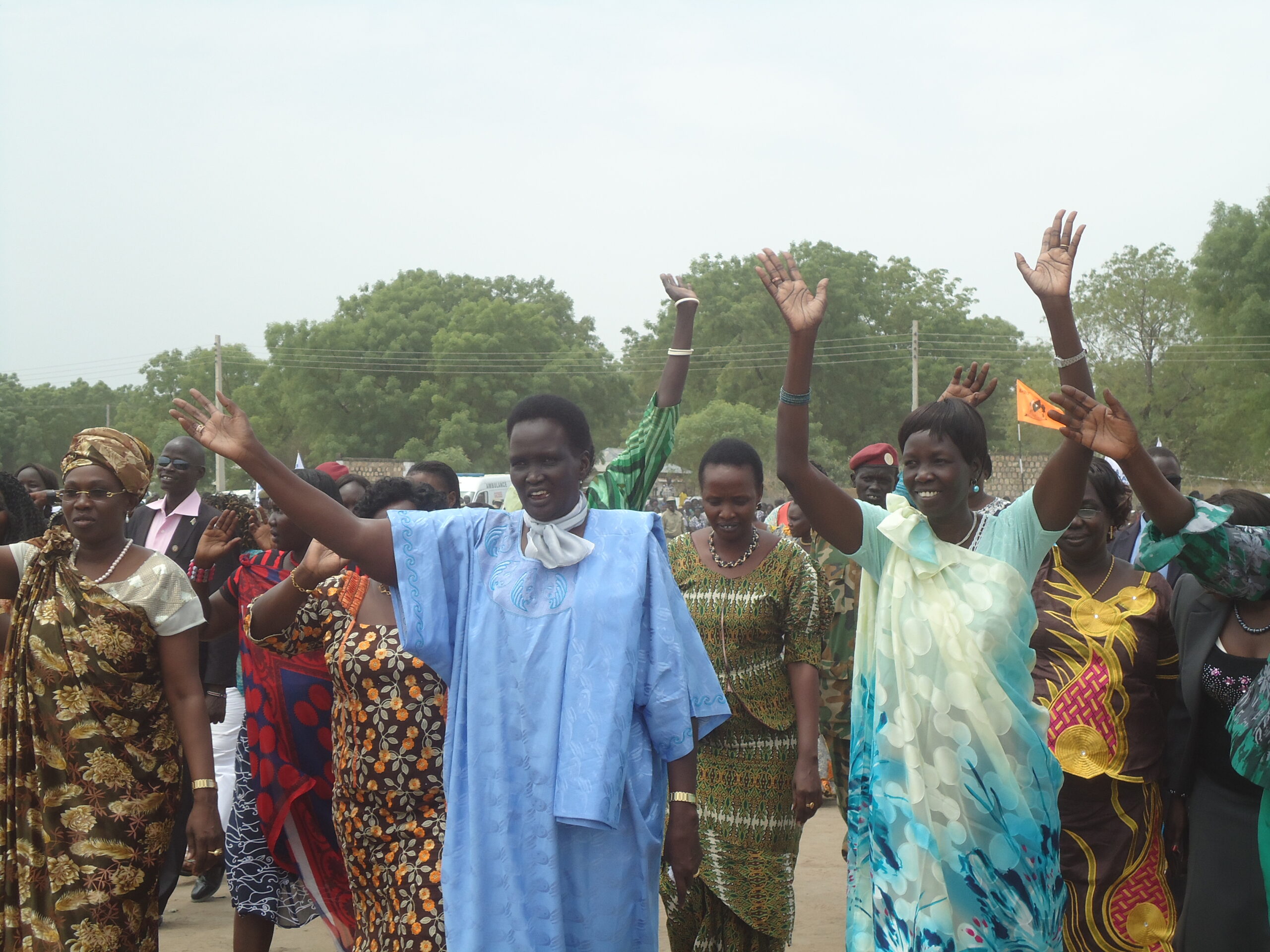Women leaders, from the left, Angilina Teny, the wife of South Sudan's Vice President Riek Machar, Rebecca Nyandeng, Presidential Adviser on gender and human rights, among others saluting women and men in Bor's Freedom Square, March 8, 2013 (ST)