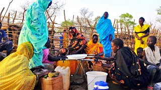 Women who fled the crisis in South Kordofan collect water from taps in the Yida refugee camp (IRC)