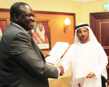 South Sudan's VP Riek Machar shaking hands with the head of Abu Dhabi Fund for Development after signing the MoU, Abu Dhabi,Mohammed Saif Al Suwaidi on Monday 18 March , 2013 (ST)