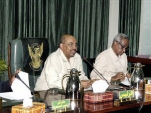 FILE - Sudanese President Omar al-Bashir, center, and Vice President Ali Osman Mohammed Taha, right, attend a cabinet meeting (AP Photo/Abd Raouf)