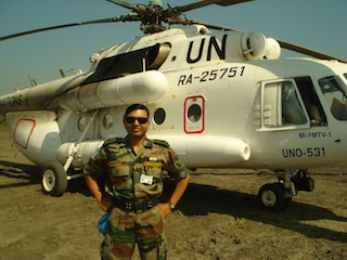 Soldier from the UN Mission in South Sudan standing next to UN plane in Pibor airstrip, Jonglei, November 27, 2012 (ST)