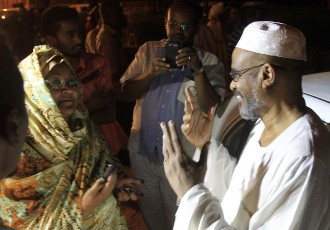 The leader of the Islamic Wasat Party Yousif al-Koda after being released from Kober prison in the Sudanese capital, Khartoum, greets a relative following his release in the early hours of April 2, 2013 (ASHRAF SHAZLY/AFP/Getty Images)