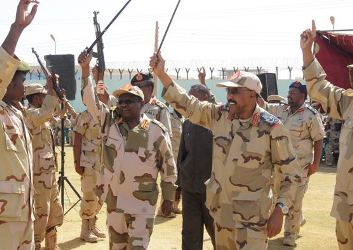 Defence minister Abdel-Rahim Hussein and NISS director Mohamed Atta wave to soldiers after a farewell celebration in Khartoum on 18 May 2013 (SUNA)