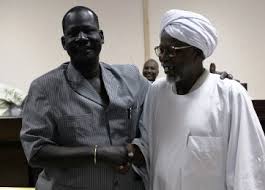 Late leader of Dinka Ngok tribe, Kuol Deng Kuol (L) shakes hands with the Misserya Al-Amer Mokhtar Papo after signing a peace agreement in the town of Kadugli north of Abeyi on January 13, 2011 (Khaled Desouki/AFP/Getty)