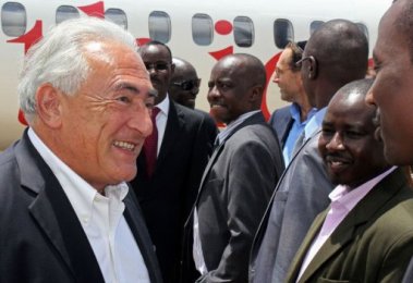 Former IMF chief Dominic Strauss-Kahn (R) arrives at Juba International Airport, on May, 13 2013. (Photo Waakhe Wudu/AFP)