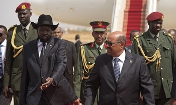 Sudan's President Omer Hassan al-Bashir (R) and South Sudan's President Salva Kiir (L) are pictured at Juba airport in Juba on April 12, 2013 (ALI NGETHI/AFP/Getty Images)