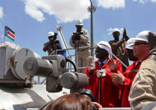 South Sudan's Petroleum and Mining Minister Stephen Dhieu Dau (3rd R) applauds as he restarts oil production in the main oil field in Palouge, after a 16-month shutdown on May 5, 2013 (Reuters)