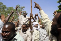 Sudan's Brigadier Mohammed Ibrahim is carried on supporter's shoulders outside his home after being released along with six other military officers convicted and jailed over a coup attempt on April 17, 2013, in Khartoum. (ASHRAF SHAZLY/AFP/Getty Images)