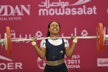 FILE - Alya Agalain of Sudan competes in the women's 58kg weightlifting competition at the Arab Games in Doha December 14, 2011 (AFP)