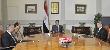 Egyptian President Mohamed Morsi (C) meets with Defense Minister Abdel Fattah al-Sisi (2nd L) with the Head of Egypt Intelligence Mohamed Raafat Shehata (L) and Interior Minister Mohamed Ibrahim (R) at El-Thadiya presidential palace in Cairo May 23, 2013 in this picture provided by the Egyptian Presidency