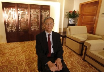 FILE - Zhong Jianhua, China's special Envoy to Africa, poses for a photograph during an interview with Reuters at the Ministry of Foreign Affairs in Beijing, July 16, 2012. (REUTERS/Michael Matina)