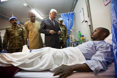 United Nations Under-Secretary-General for Peacekeeping, Hervé Ladsous, flanked by UNAMID chief, visits a peacekeeper  hospitalized in Nyala after an attack by unknown assailants in Lavado, East Darfur on Wednesday  (Photo Albert Gonzalez Farran /UNAMID)