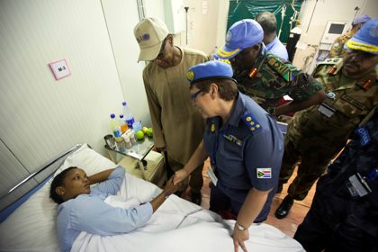 A UNAMID police woman who recovers in the UNAMID hospital in Nyala after an attack on their patrol Saturday received the visit of the UNAMID leadership (from left to right), the Joint Special Representative, Mohamed Ibn Chambas, the Police Commissioner, Hester Andriana Paneras, and the acting Force Commander, Lieutenant General Paul Ignace Mella from Tanzania on Sunday 14 July  2013. (Photo by Albert González Farran, UNAMID)