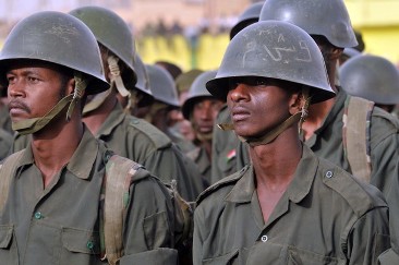 FILE - Sudanese soldiers stand to attention during President Omer al-Bashir's visit to the Popular Defence Forces in Khartoum on March 3, 2012 (EBRAHIM HAMID/AFP/Getty Images)