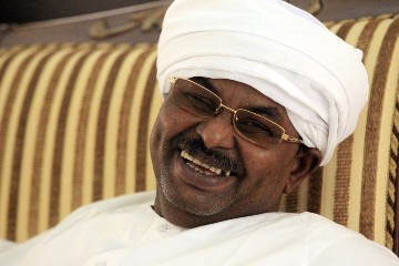 Salah Gosh, former chief of Sudan's National Intelligence and Security Services (NISS), smiles at his home after his release, in Khartoum July 10, 2013 (REUTERS/Mohamed Nureldin Abdallah)