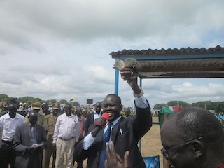 Bor town mayor, Nhial Majak, showing the money collected for development projects in the Jonglei capital, June 29, 2013 (ST)