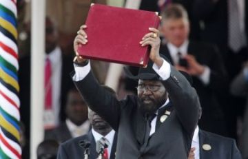 South Sudan's president, Salva Kiir, displays the country's transitional constitution after signing it into law during Independence Day celebrations in the capital Juba on 9 July 2011 (REUTERS/Thomas Mukoya)