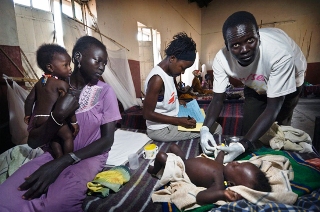 An MSF nurse treats a baby with dehydration in Jonglei state (MSF/Stephen Torfinn)