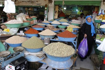 A Sudanese woman shops for Ramadan at a market in the Sudanese capital, Khartoum, on 8 July 2013 (Photo: AP/Abd Raouf)