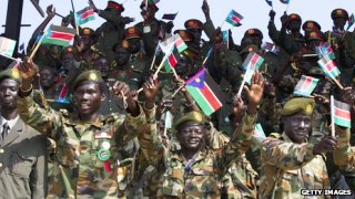 South Sudan army wave flags during the July 9, 2011 celebrations (Getty)