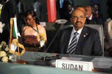 Sudan's President Omer al-Bashir takes part in the African Union Summit on health focusing on HIV/AIDS, TB and malaria in Abuja on July 15, 2013 (PIUS UTOMI EKPEI/AFP/Getty Images)