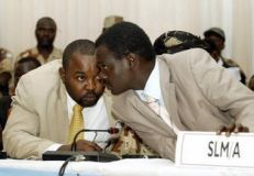 A file photo where Abdel Wahid Mohamed Al-Nur (L) and Minni Arcua Minnawi, talk during a round of peace negotiations in Abuja, Nigeria  on May 1, 2006