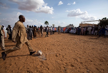 UNAMID Joint Special Representative, Mohamed Ibn Chambas, kicks out a ball after a football match in Al Neem camp for Internally Displaced Persons in El Daein, East Darfur, between players from El Daein and Al Neem IDP camp on July 3, 2013  (Photo Albert González Farran, UNAMID)