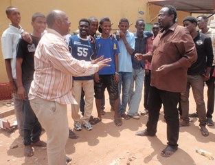 Sudan comedians Ibrahim Khider and Ahmed Omer give an impromptu performance to volunteers outside Nafeer's headquarters in Khartoum (ST)