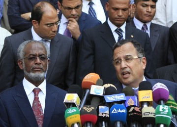 Egyptian Foreign Minister Nabil Fahmy (R) stands next to his Sudanese counterpart Ali Karti as they address the press in Khartoum on August 19, 2013 (ASHRAF SHAZLY/AFP/Getty Images)