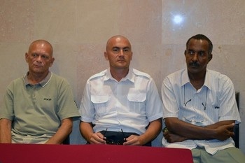 Crew members of an helicopter, two Ukrainians and a Sudanese, that were held captive since early August, sit in an hotel of the South Darfur state capital Nyala on August 28, 2013 (AFP/GETTY IMAGES)