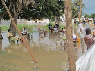 Displaced in Bor town relax while seated on chairs in the flood, September 4, 2013 (ST)