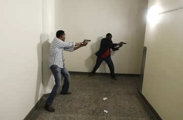 Armed police search Westgate Shopping Centre in Nairobi, September 21, 2013. (REUTERS/Goran Tomasevic)