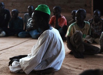 South Sudanese Madrasa students recite the Koran at a Koranic school in Konyokonyo area, in the capital Juba, June 17, 2013. The school was established in 1979 and most of the students are orphans. Picture taken June 17, 2013 (REUTERS/Andreea Campeanu)