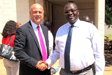 SPLM deputy chairman and former South Sudan Vice President, Riek Machar Teny, shaking hands with the Vice President for Programs of the US-based IRI, Juba, on Oct. 19, 2013 (ST)