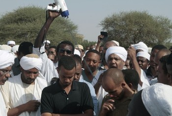 Family members and friends gather for the funeral of Salah Mudathir, 28, killed in clashes following protests in the Sudanese capital, Khartoum, in September 2013 (Photo: Ashraf Shazly/AFP/Getty Images)