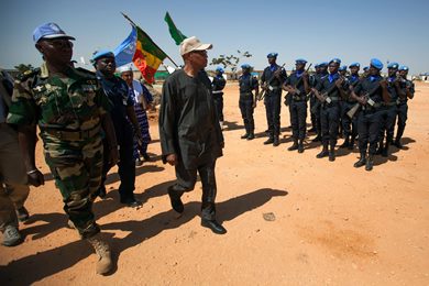 UNAMID Joint Special Representative, Mohamed Ibn Chambas, (C) salutes and gives condolences to some of the members of the UNAMID Formed Police Unit (FPU) from Senegal based in El Geneina, West Darfur on 15 October 2013. (Photo by Albert González Farran/UNAMID)