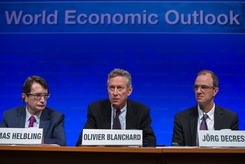 IMF representatives pictured at a press briefing on the World Economic Outlook during the 2013 World Bank/IMF annual meetings on 8 October 2013 in Washington (Photo: Michael Spilotro/IMF via Getty Images)