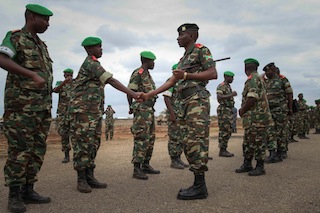 Burundi Chief of Defence Forces, Major General Prime Niyongabo, greets senior officers from the Burundi Contingent serving with AMISOM stationed in the capital of Bay Region, south-central Somalia, during a visit on 30 August 2013. AU-UN IST PHOTO / ABDI DAKAN