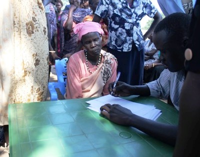 A woman registering to vote at a school in the border town of Abyei on Oct. 20, 2013(Credit: Andrew Green/IPS)