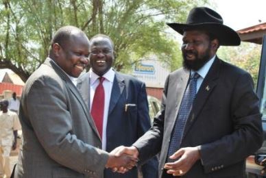 FILE PHOTO : President Salva Kiir ® shakes hands with SPLM general secretary Pagan Amum (L) and former vice-president Riek Machar smiling on 14 January 2010 before to start the 6th meeting of the SPLM political bureau in Juba
