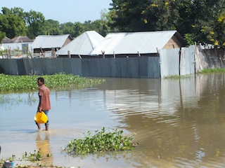 A resident walks through flood waters in Bor, the capital of South Sudan's Jonglei state (ST)