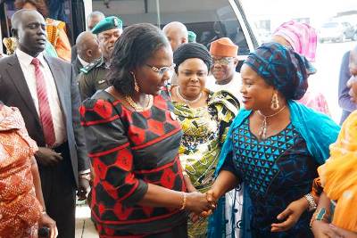 South Sudan first lady Mary Ayen Mayardit (L) shares a moment with her Nigerian counterpart Patience Goodluck Jonathan in Abuja, Nigeria (Photo: Larco Lomayat)