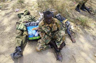 A South Sudan army soldier rests in Bor town, after its recapture  on December 25, 2013 a week after the town fell to rebels loyal to rebel leader Riek Machar.(Photo Reuters/James Akena)