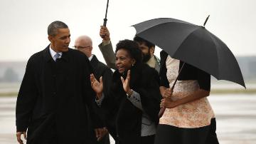 US president Barack Obama (L) is welcomed following his arrival in South Africa to attend a memorial service for Nelson Mandela on 10 December 2013 (Photo: REUTERS/Kevin Lamarque)