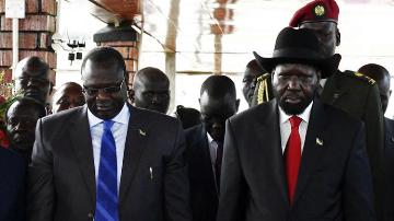 South Sudan's then vice-president Riek Machar (L) and president Salva Kiir pay their respects at John Garang's Mausoleum, during the celebration of the second anniversary celebrations of South Sudan's independence in the capital, on 9 July 2013 (Photo: Reuters/Andreea Campeanu)