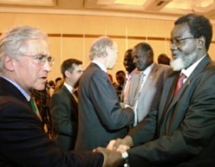 Members of the South Sudanese delegation meet western observers ahead of peace talks in the Ethiopia on 4 January 2014 (AP)